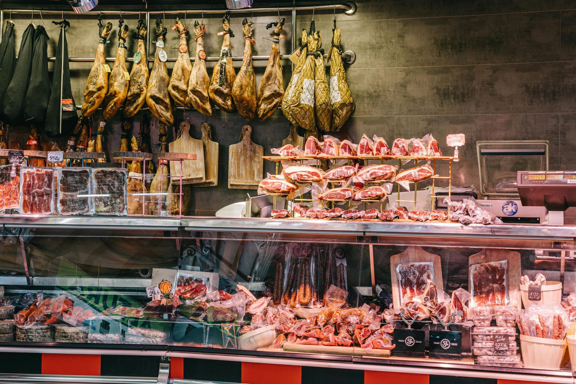 A butcher shop filled with lots of meat and vegetables.