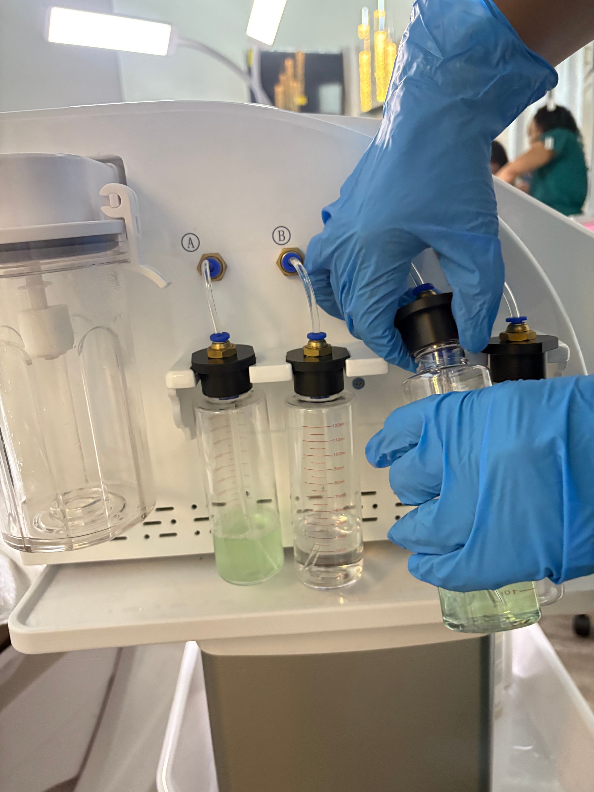 A woman is smiling while looking at herself in a mirror.