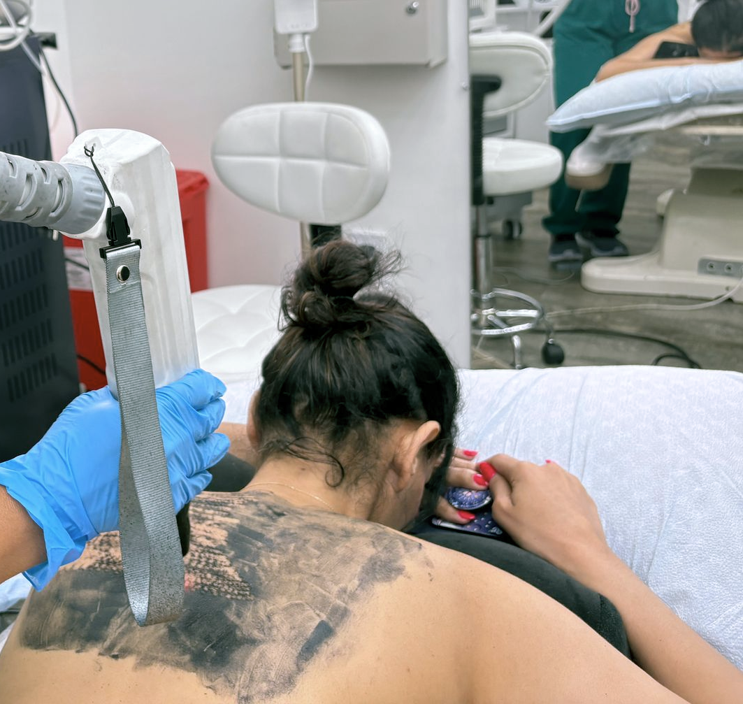 A woman is getting a facial treatment at a spa.