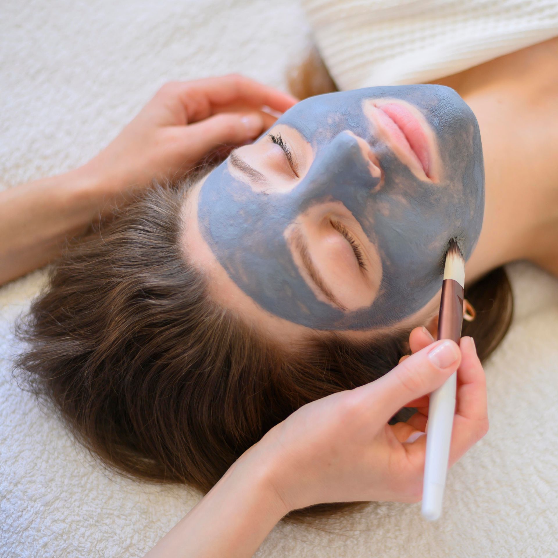 A woman with a blue mask on her face