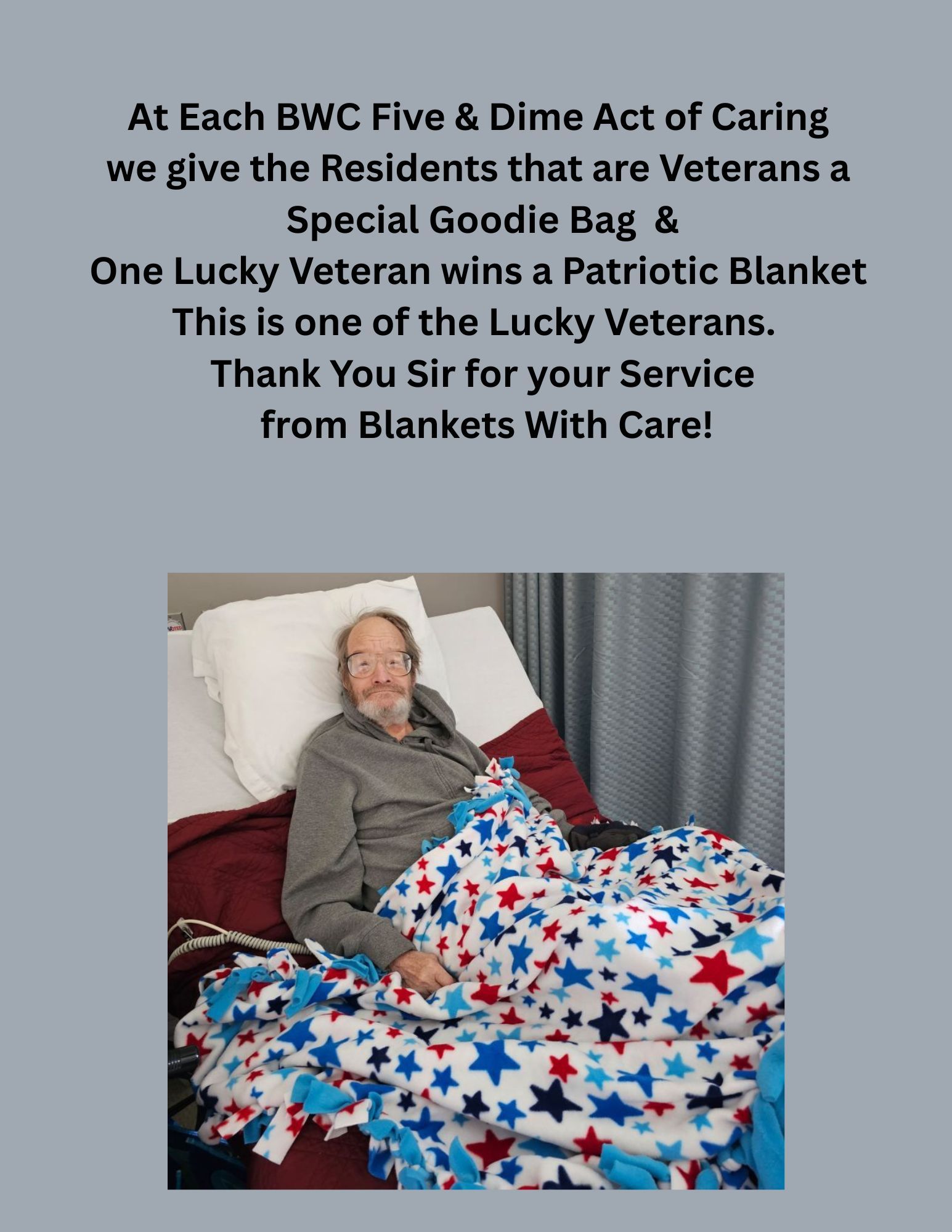 A man is laying in a bed with a patriotic blanket.