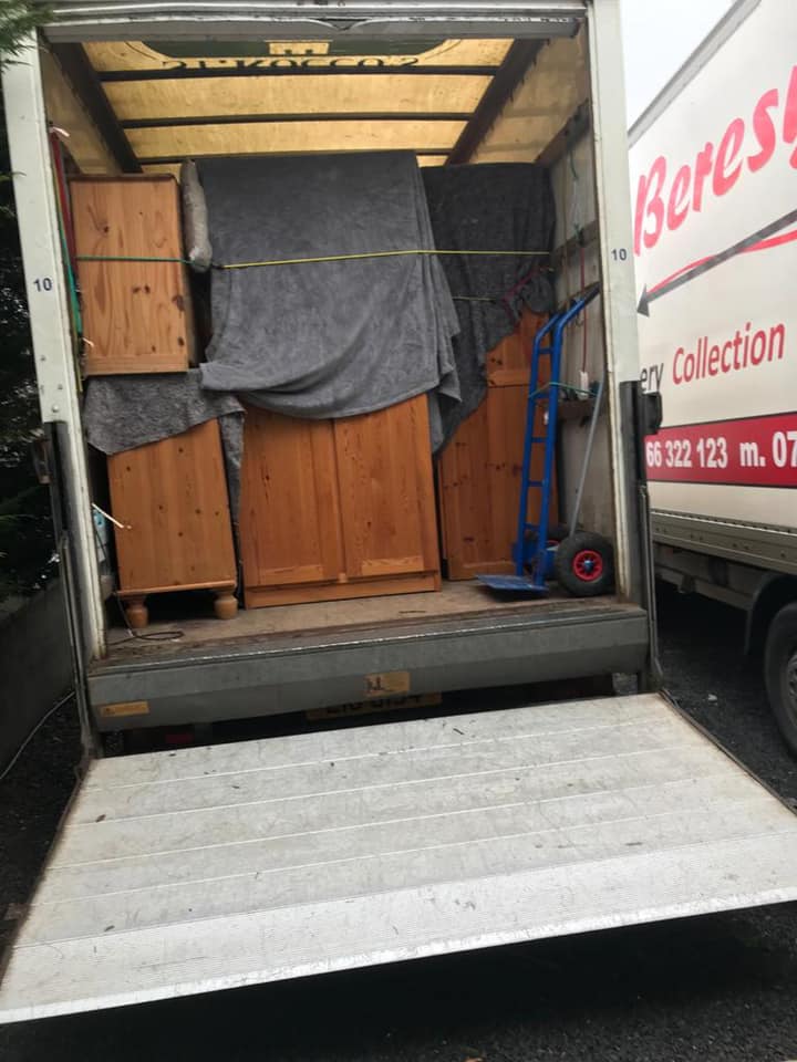 View into the back of an efficiently packed removals van