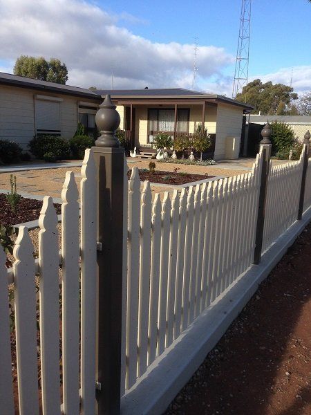 A white picket fence in front of a house | Roseworthy, SA | Bazza's Fencing
