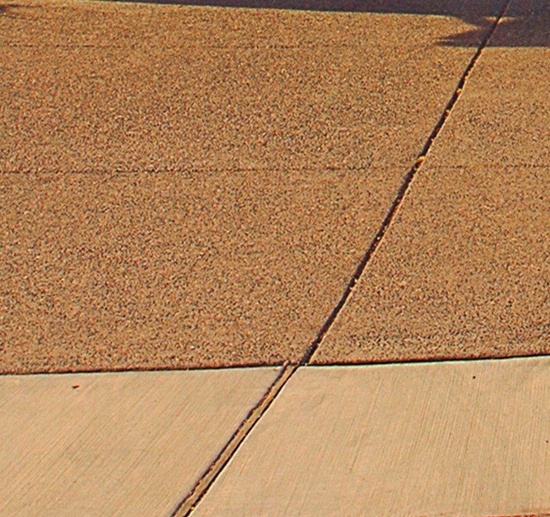 Residential walkway in coloured concrete in different shades of brown in Cranbourne VIC.
