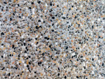 Closed up look of exposed aggregate concrete surface installed for a commercial space in Cranbourne VIC.