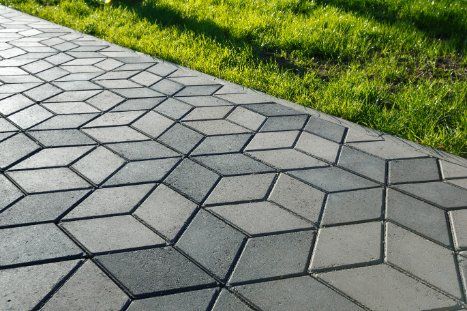 Stunning dual toned stamped concrete pathway installed by the expert concrete contractor in Cranbourne VIC.