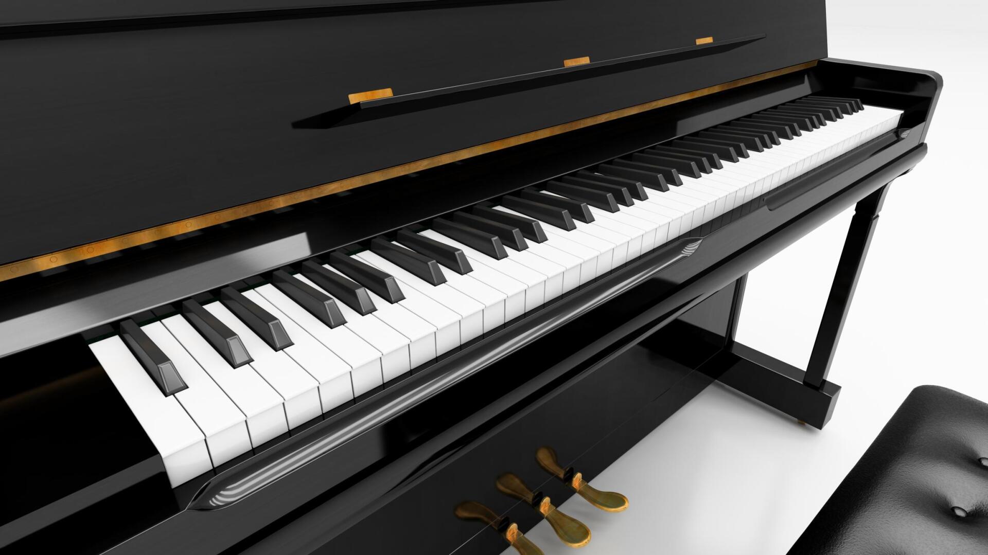 Close-up of a black upright piano with white and black keys; foot pedals visible below.
