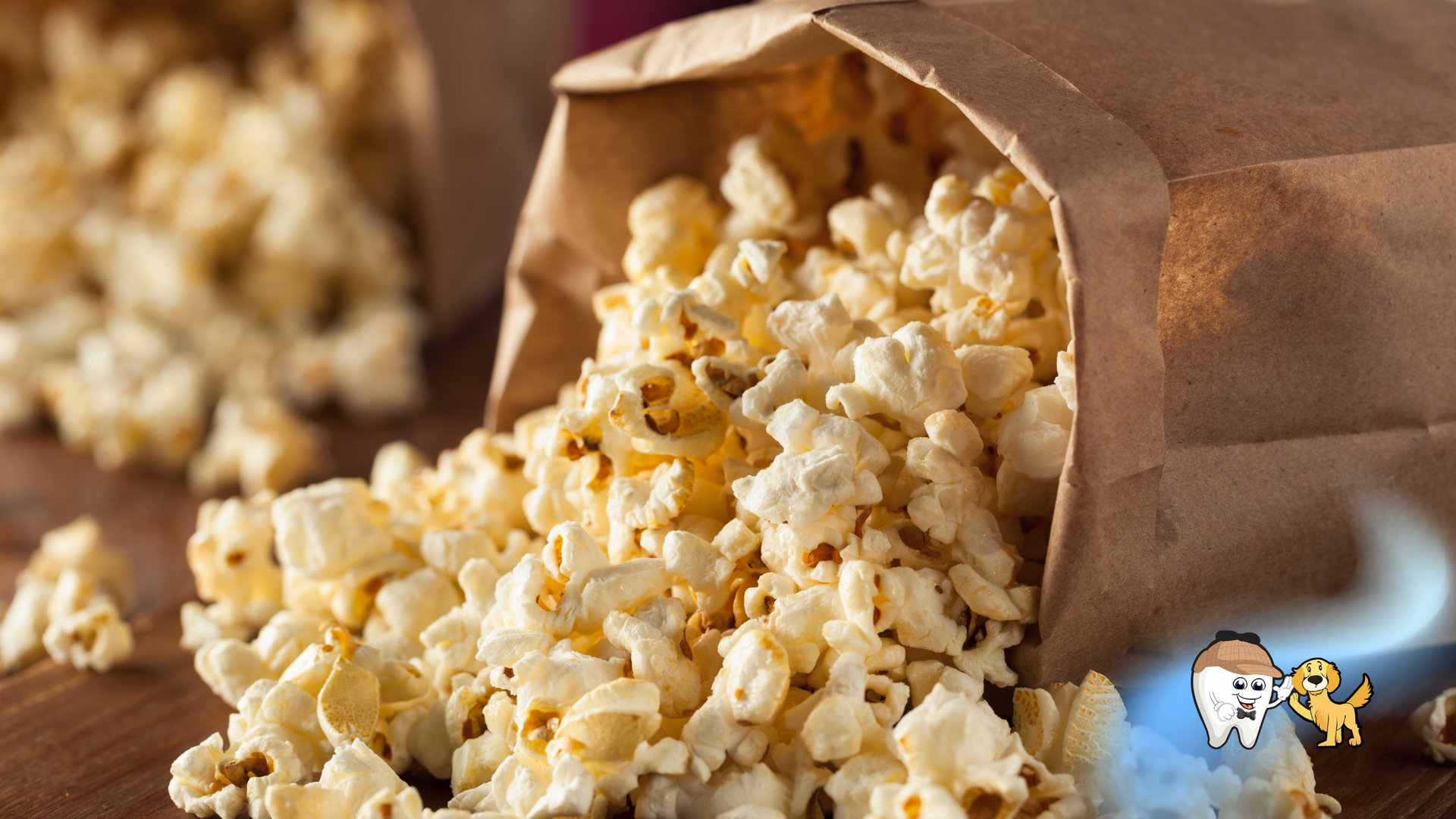 Popcorn spilling out of two brown paper bags.