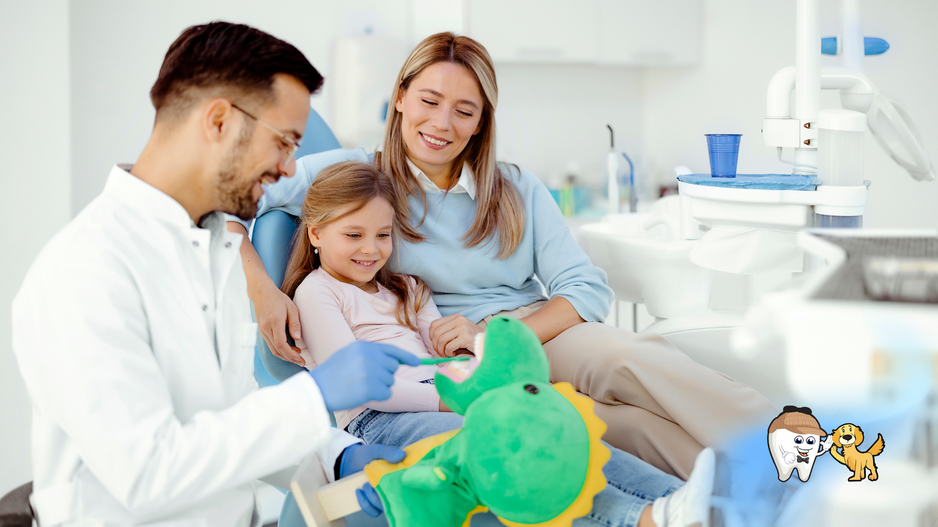 A dentist is brushing a child 's teeth while a woman holds a stuffed dinosaur.