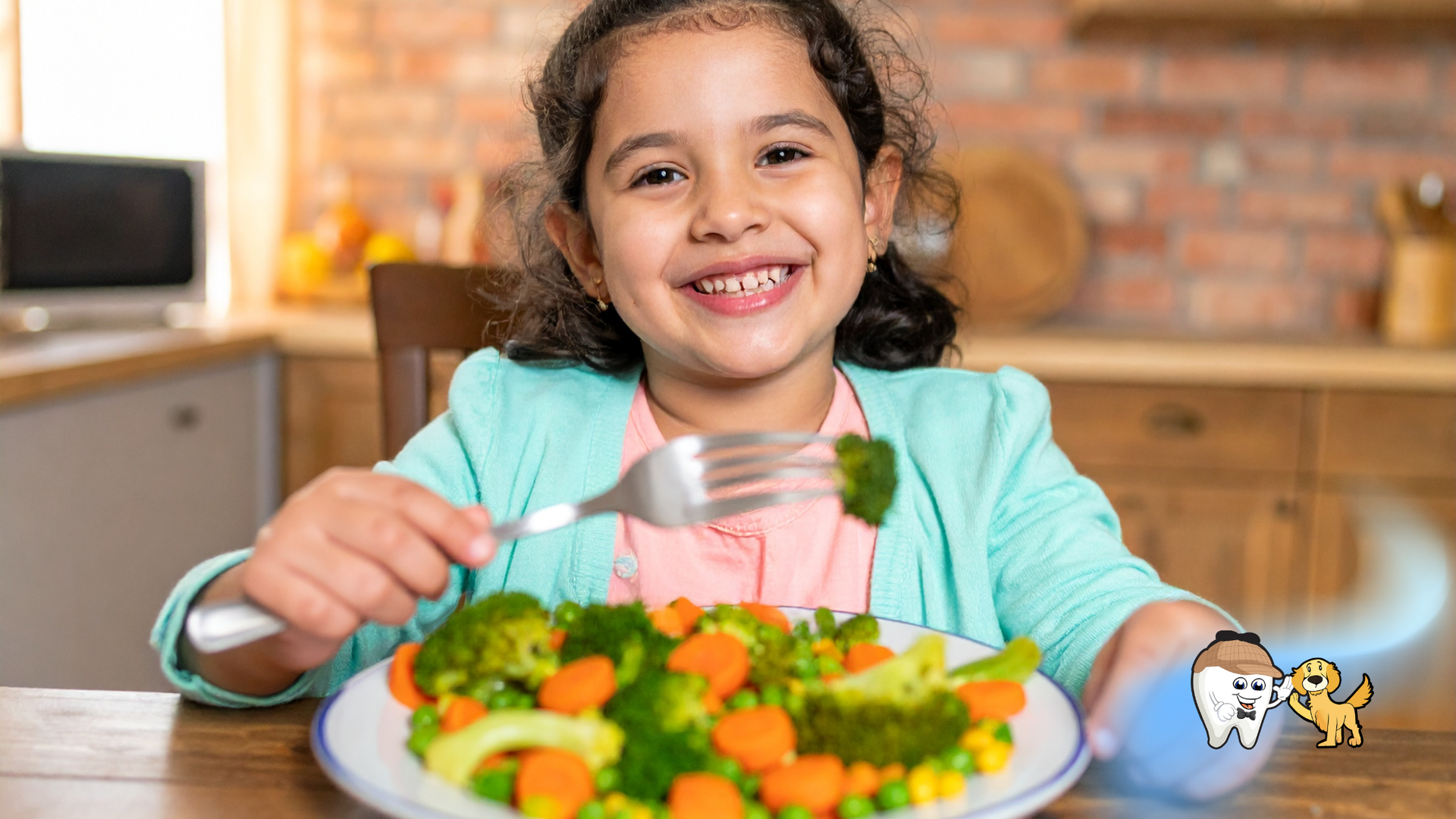 Young girl smiling, eating vegetables at a table in a kitchen.