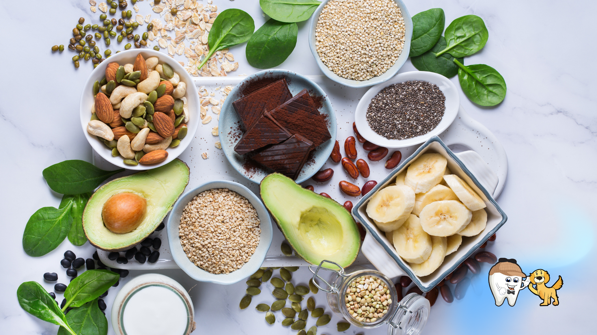 Overhead shot of healthy foods in bowls: nuts, seeds, avocado, spinach, and banana slices.