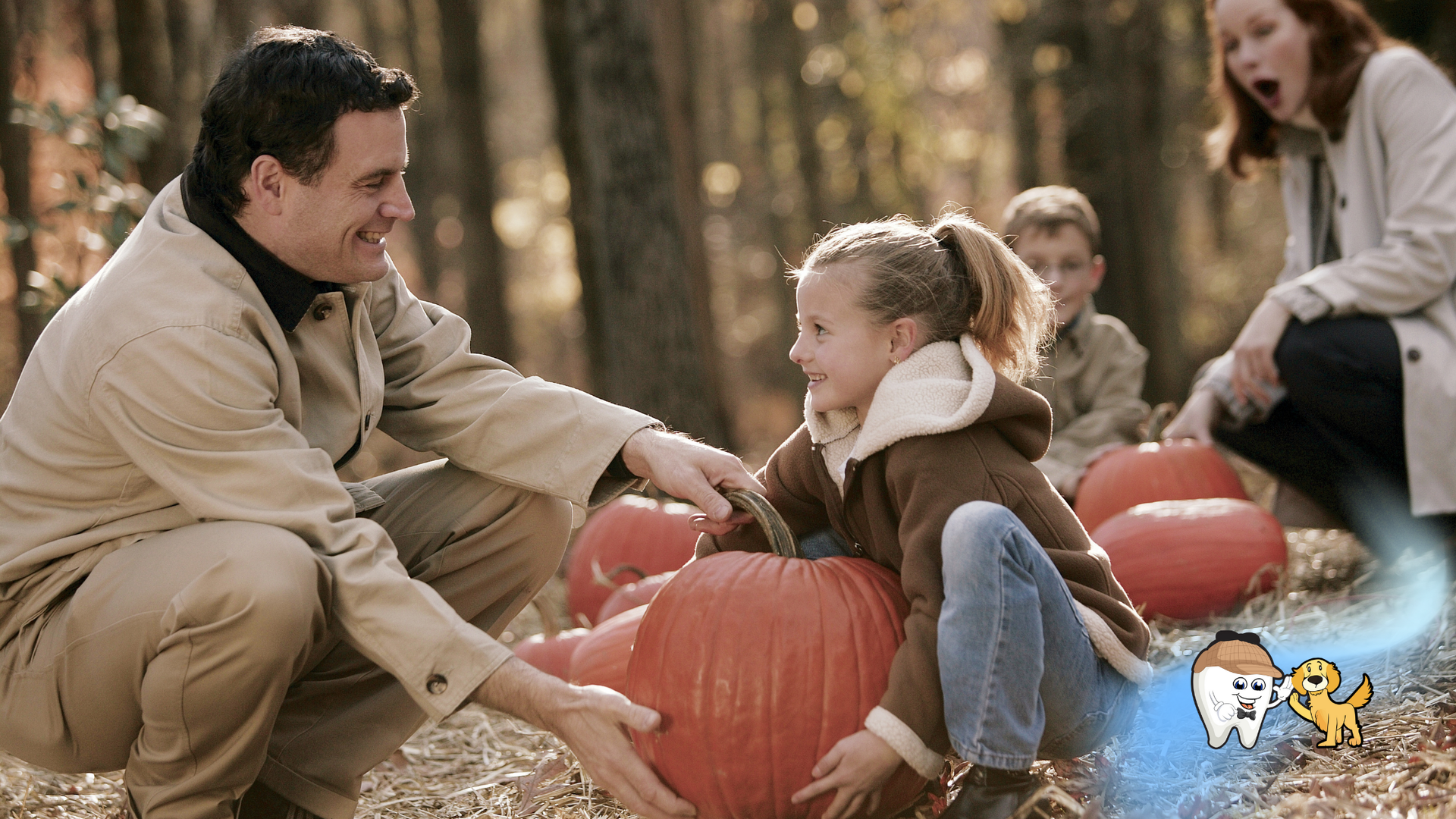 Family at pumpkin patch; father and daughter with pumpkin, mother and son in background, fall setting.