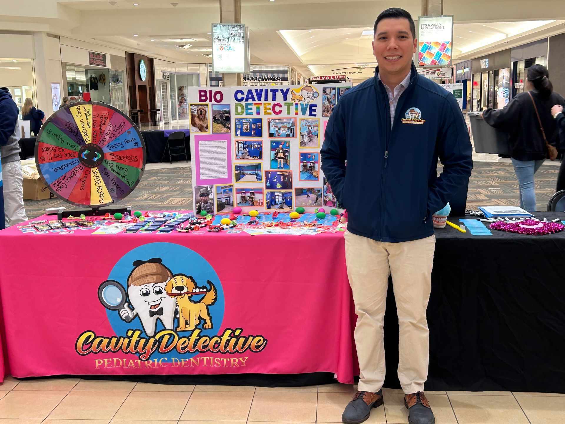 a group of men pose in front of a happy 4th of July banner | Dr. John Ding donating His Time To Veterans | Cavity Detective | Best Pediatric Dentist In Tinton Falls, NJ