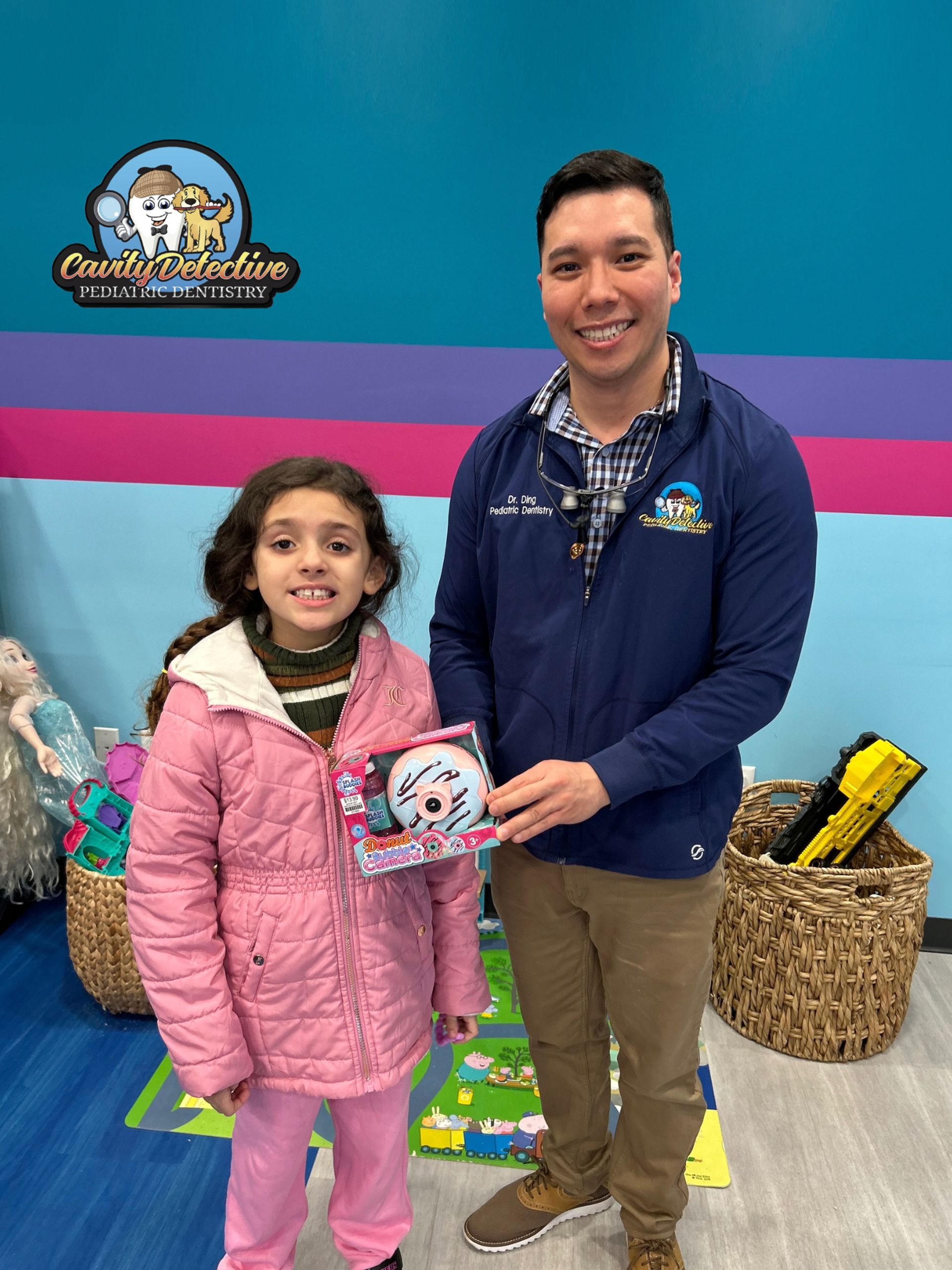 Man holding a certificate stands in front of a 