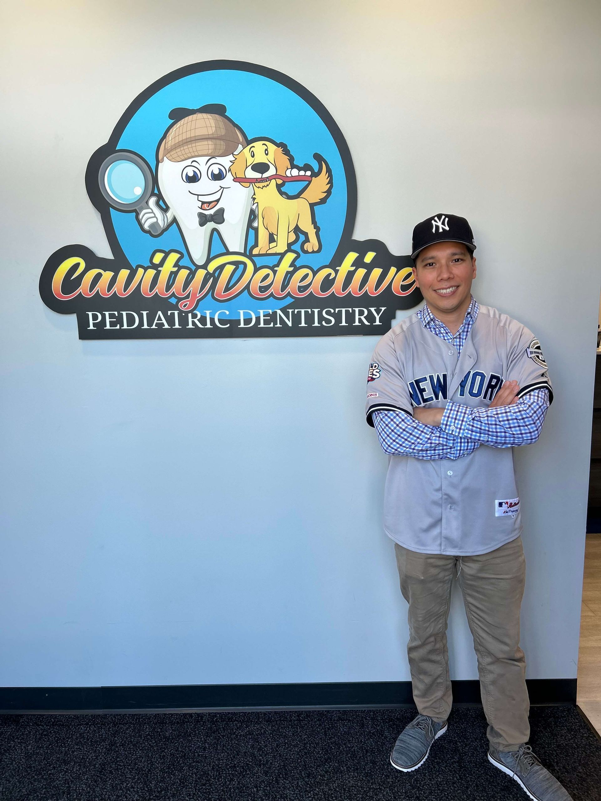 Person in a Yankees jersey stands in front of