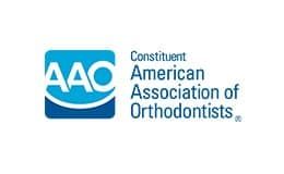 The logo for the American Association of Orthodontists is blue and white.