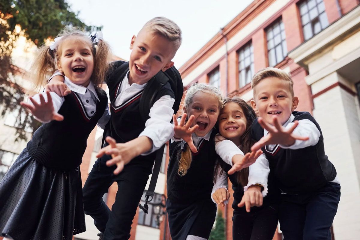 children wearing a school uniform