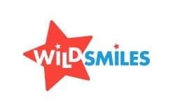 A logo for Wild Smiles with a red star in the middle.