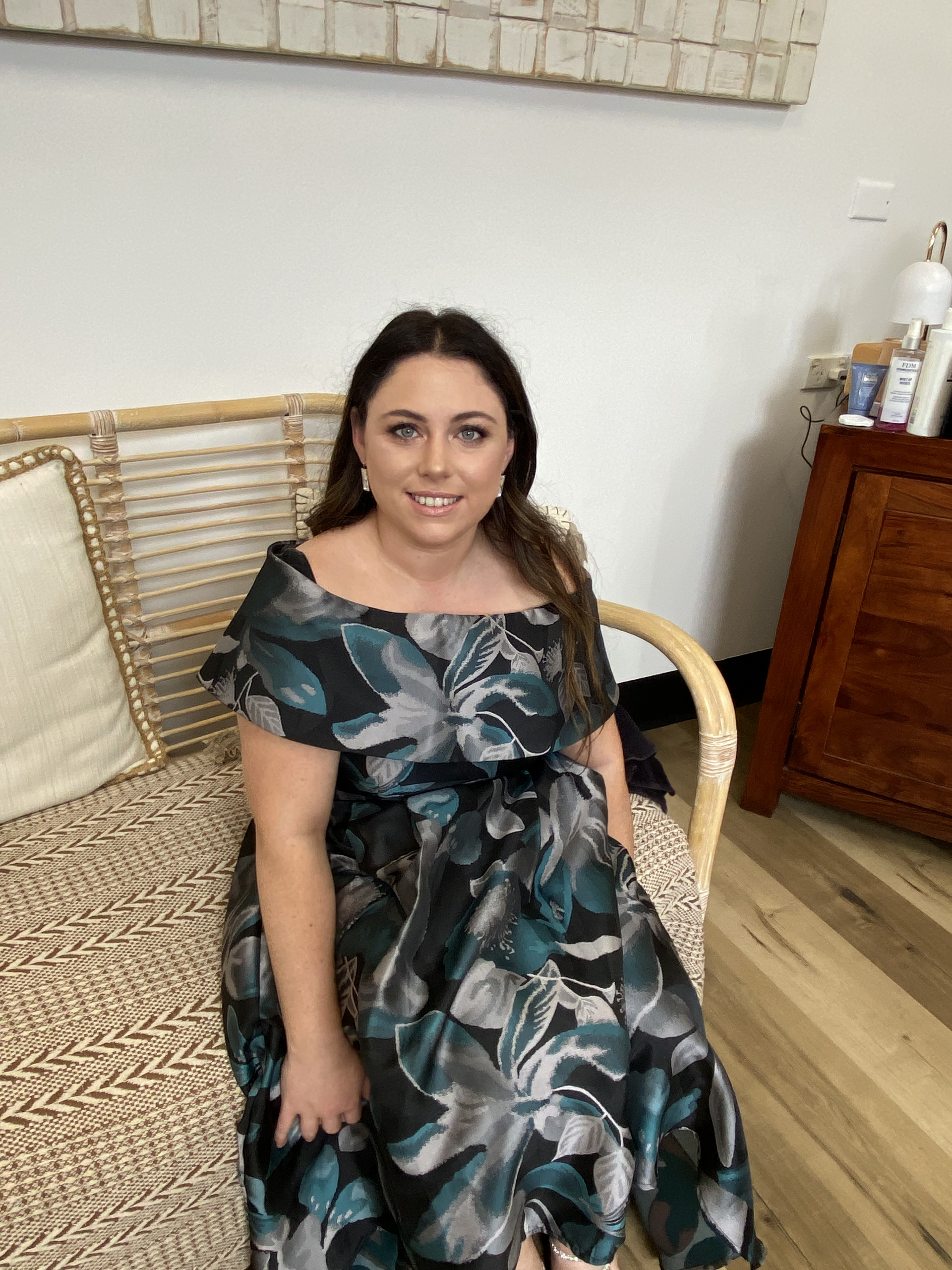 Woman With Smoky Eye Makeup And Curled Blonde Hair — Penelope's Beauty in Raymond Terrace, NSW