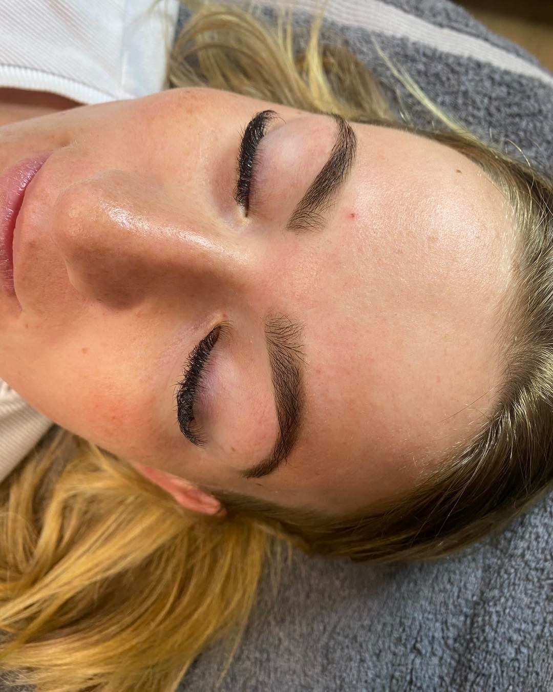 Person With Closed Eyes, Newly Tattooed Eyebrows — Penelope's Beauty in Raymond Terrace, NSW
