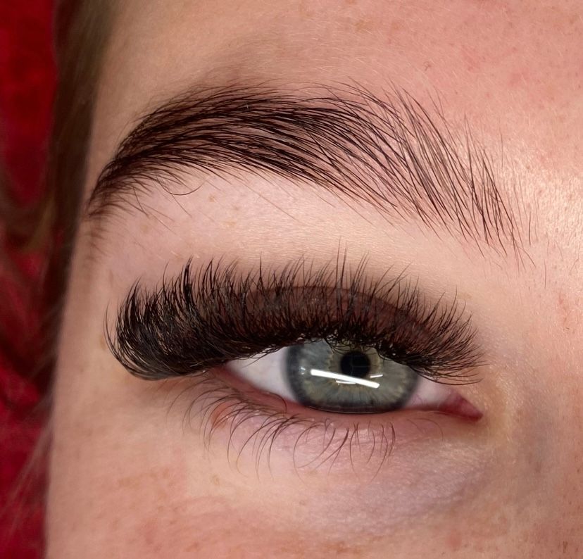 Woman With Black Hair And Long Eyelashes Wearing A Yellow Top — Penelope's Beauty in Raymond Terrace, NSW