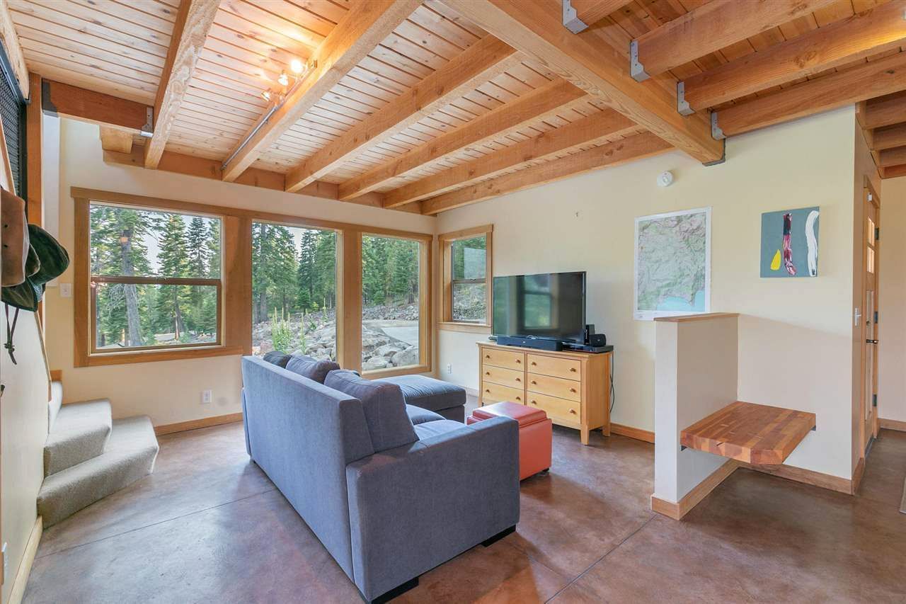 A living room with a couch and a television