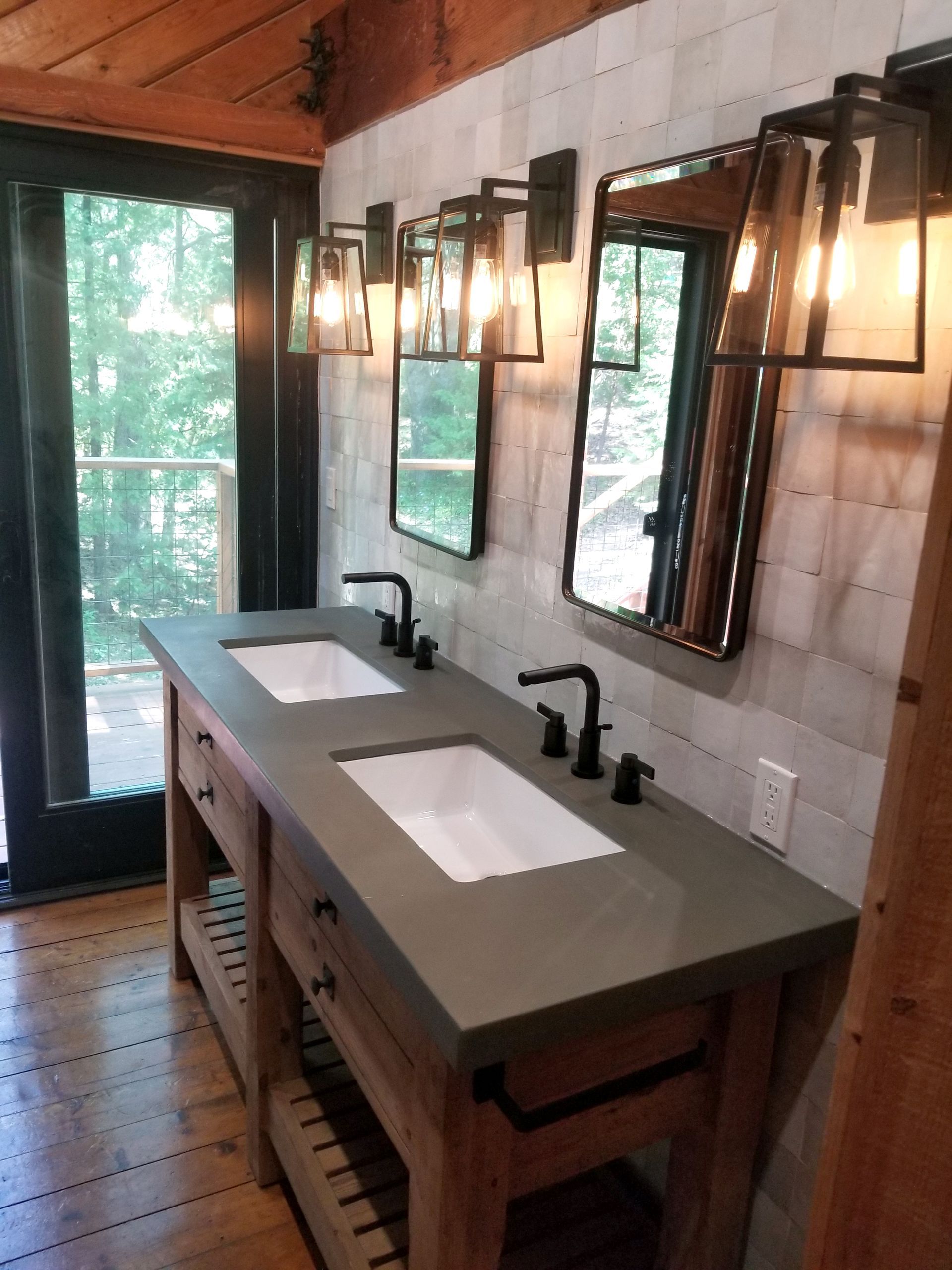 A bathroom with two sinks and two mirrors.