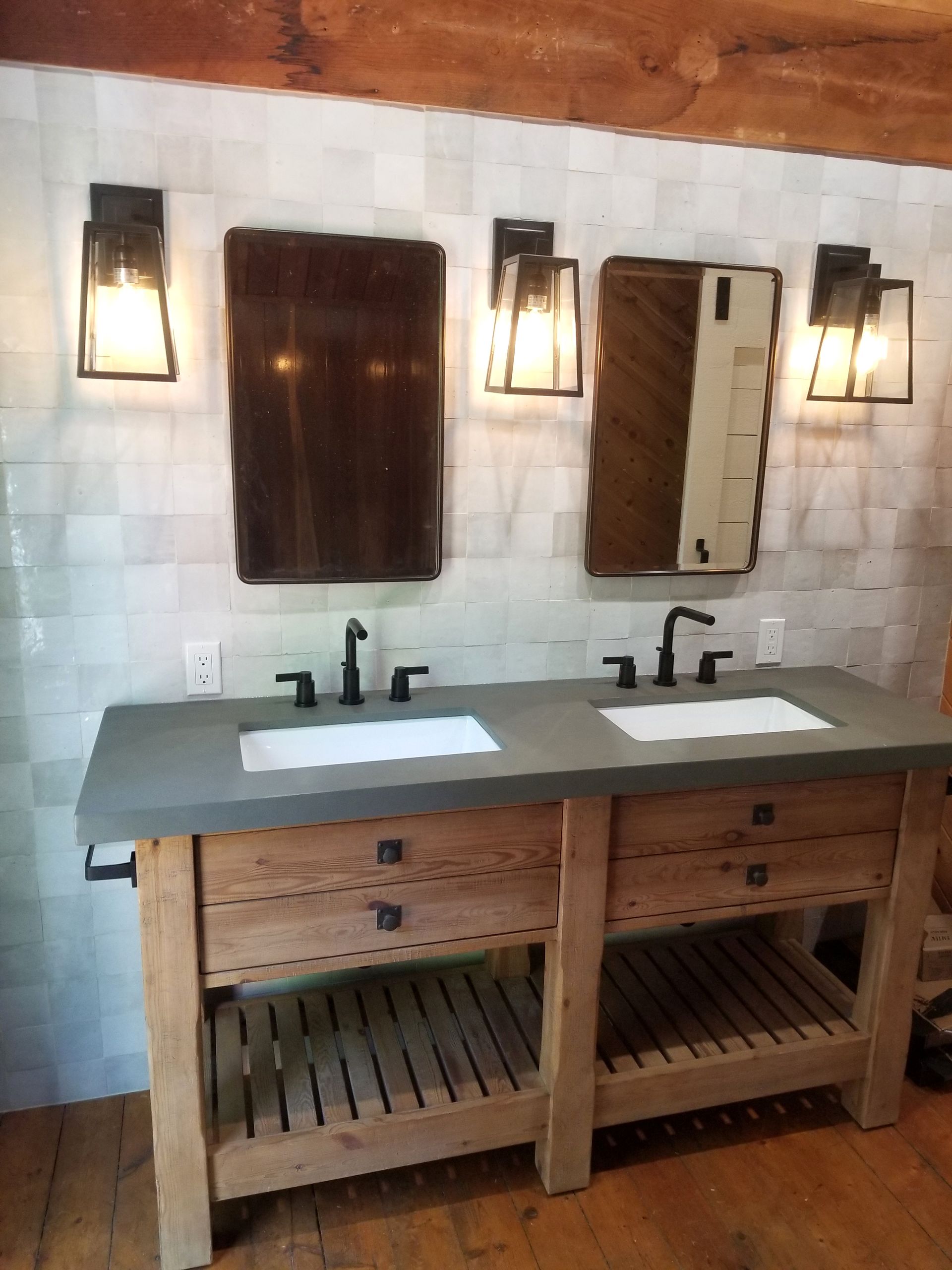 A bathroom with two sinks and two mirrors