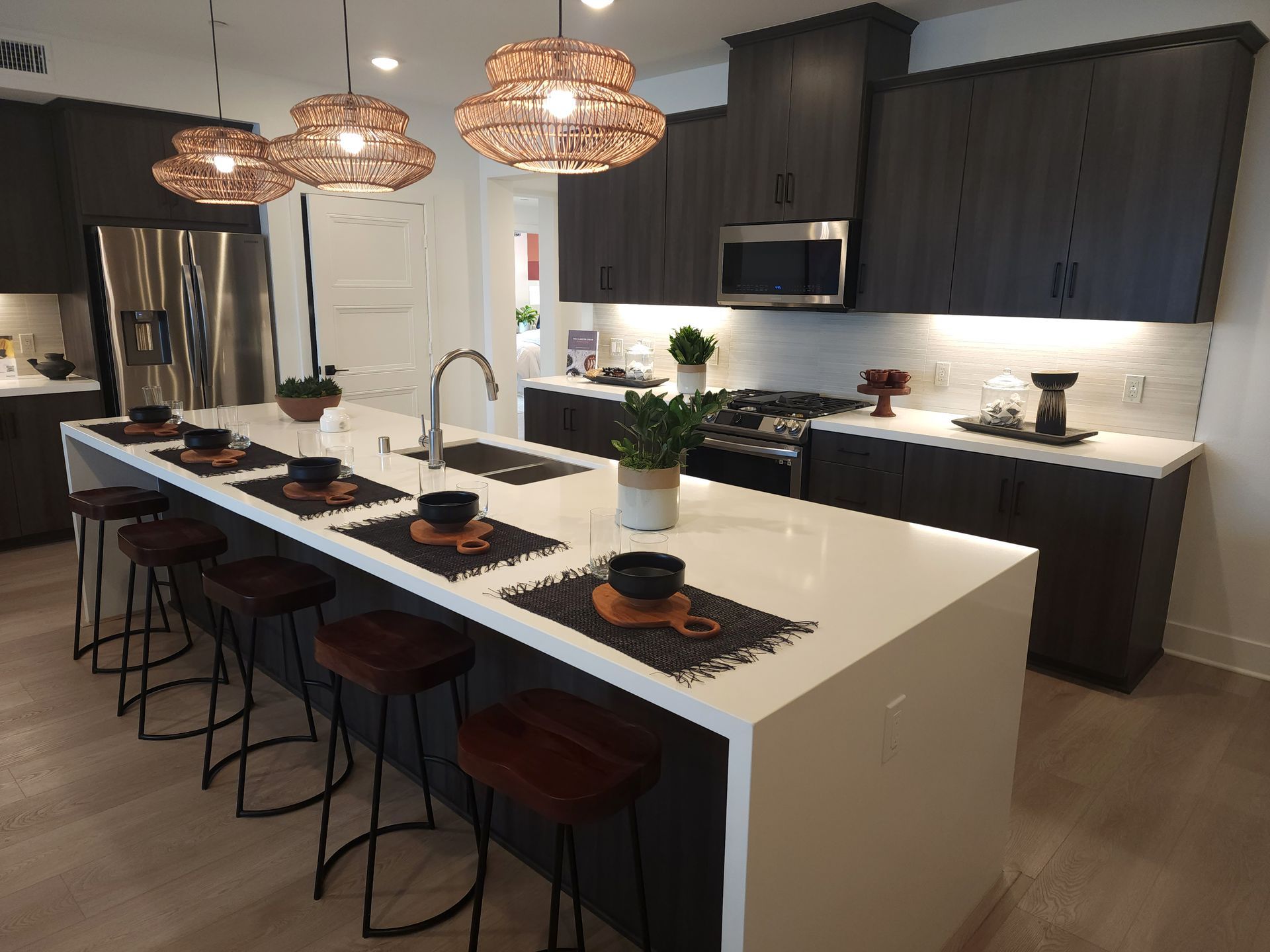 A kitchen with a large island and stools