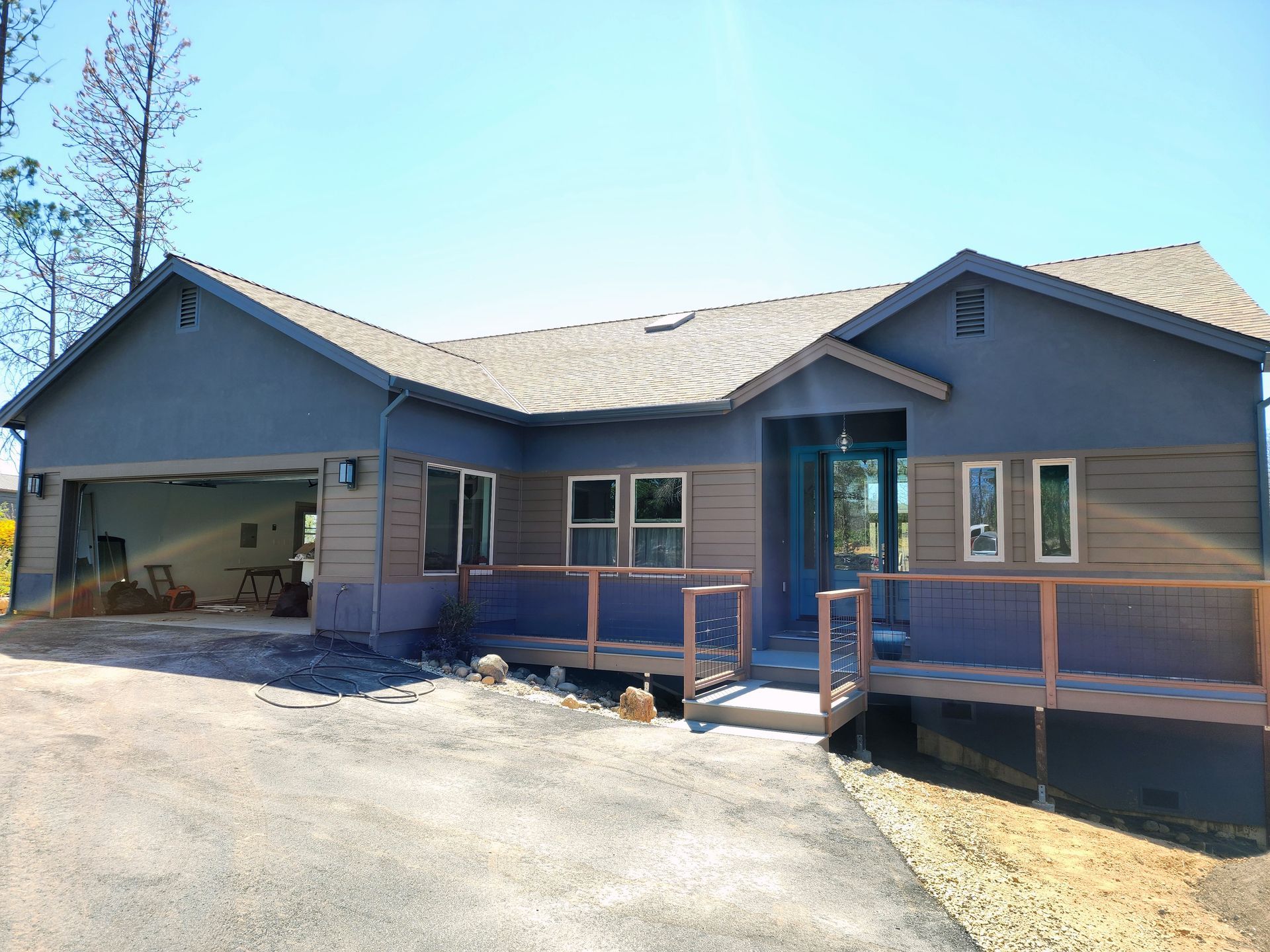 A large house with a garage and a porch