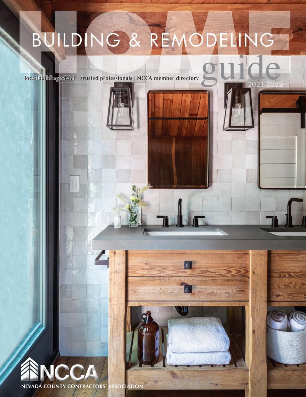 A bathroom with two sinks and a mirror on the cover of a building and remodeling guide.