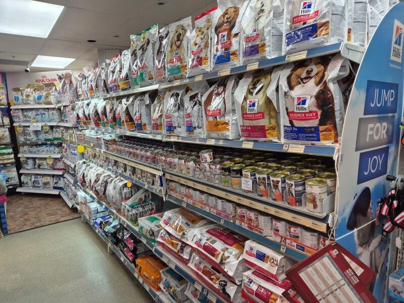 A store filled with lots of dog food including hill 's science diet