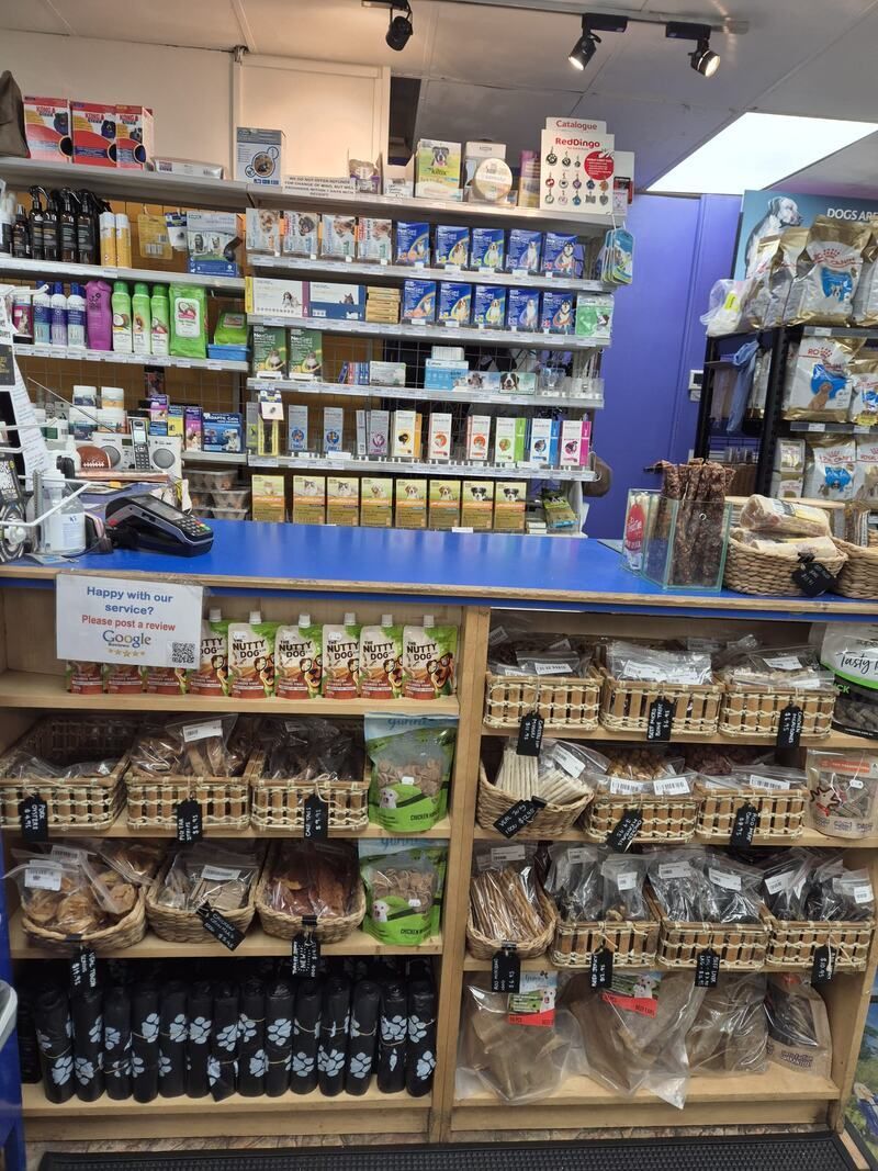 A store filled with lots of shelves and baskets of food.