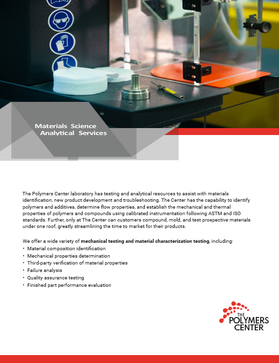 A man is working on a machine in a factory.