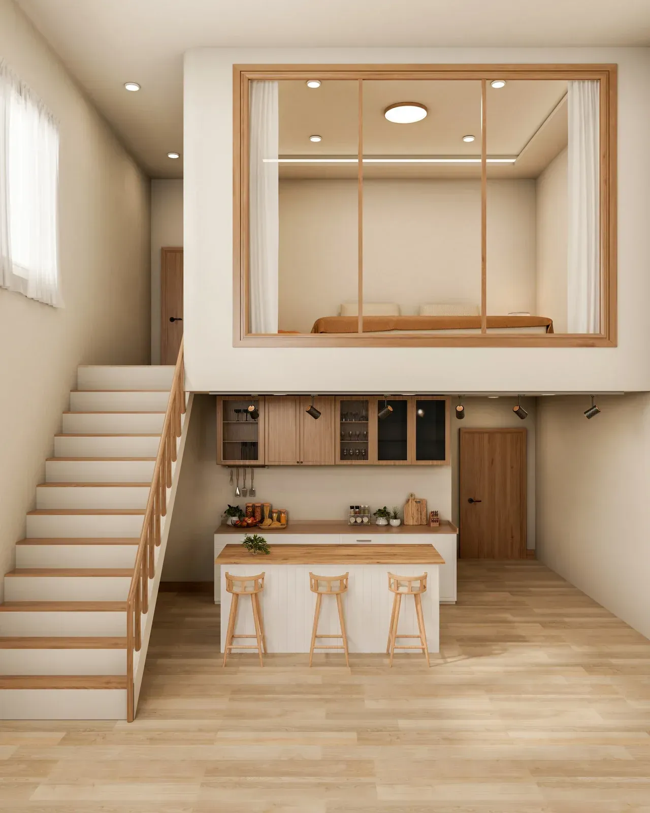 Interior view of a small apartment with a lofted bedroom, kitchen, and staircase; wood and light colors.