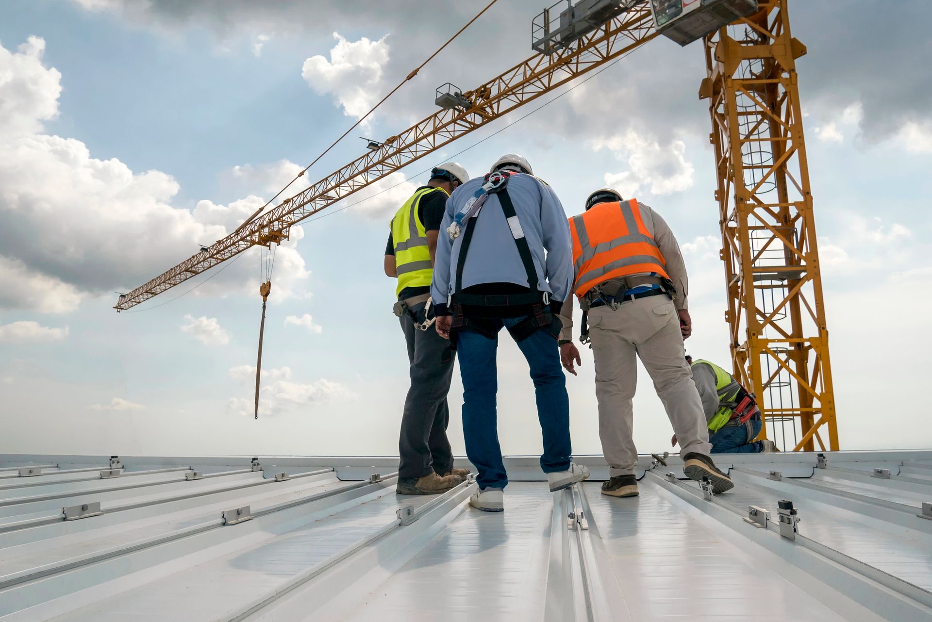 Contractors checking the roofing installed.