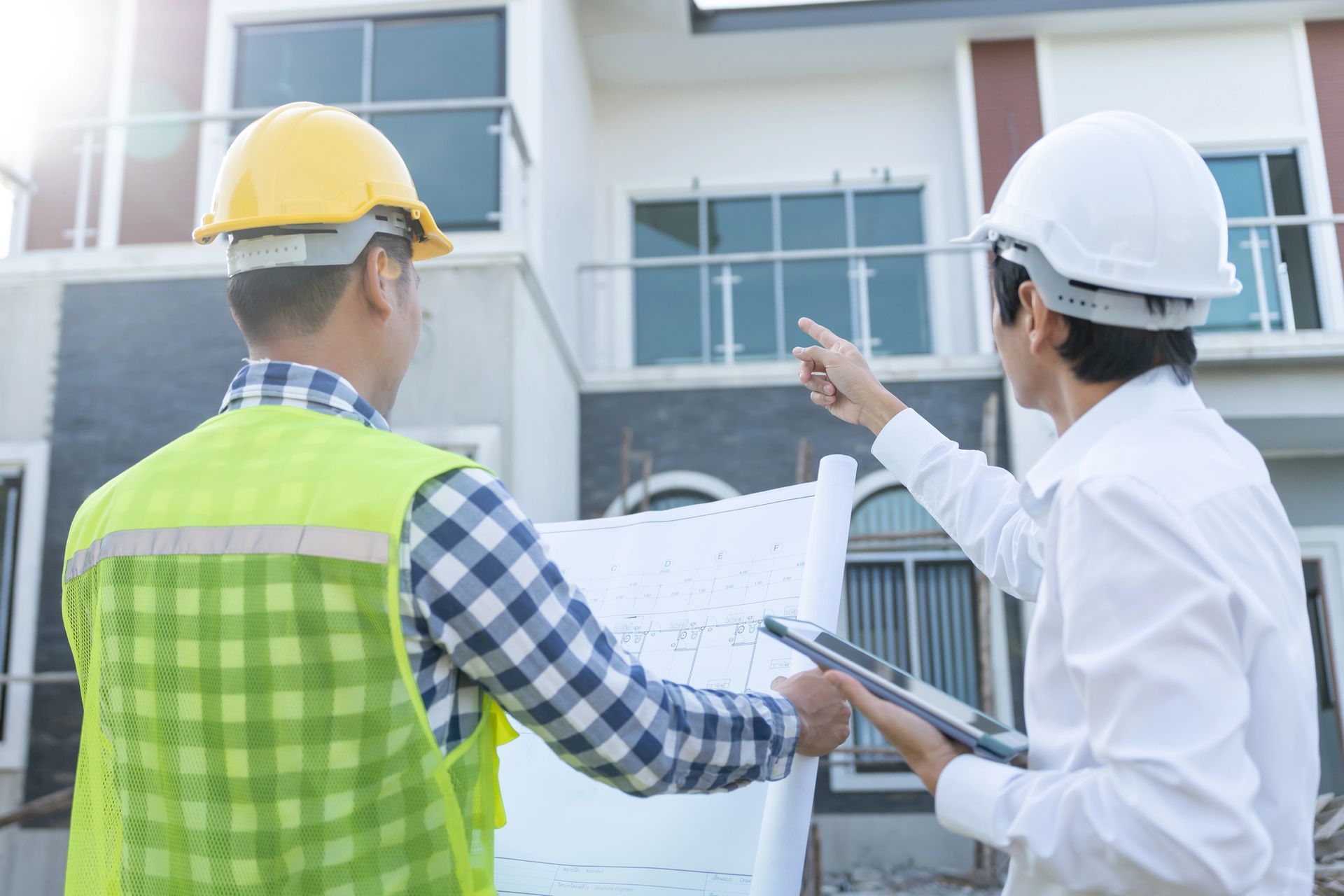 Two contractor inspecting the house.