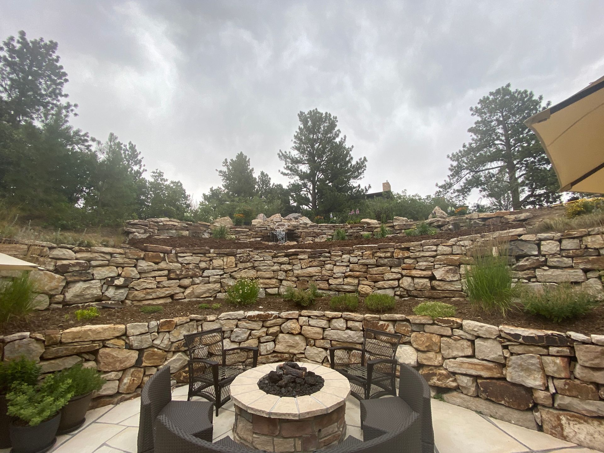Outdoor white brick BBQ grill with sea view.