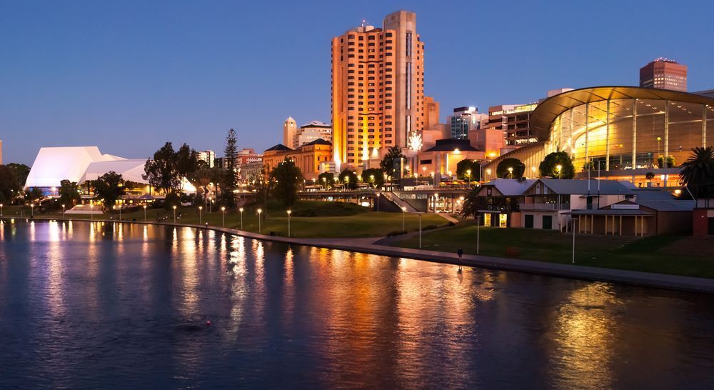 A City at Night With a Large Body of Water in the Foreground — Go Pack Yourself in Adelaide, SA