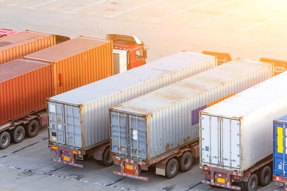 A Row of Trucks Parked Next to Each Other in a Parking Lot — Go Pack Yourself in Adelaide, SA