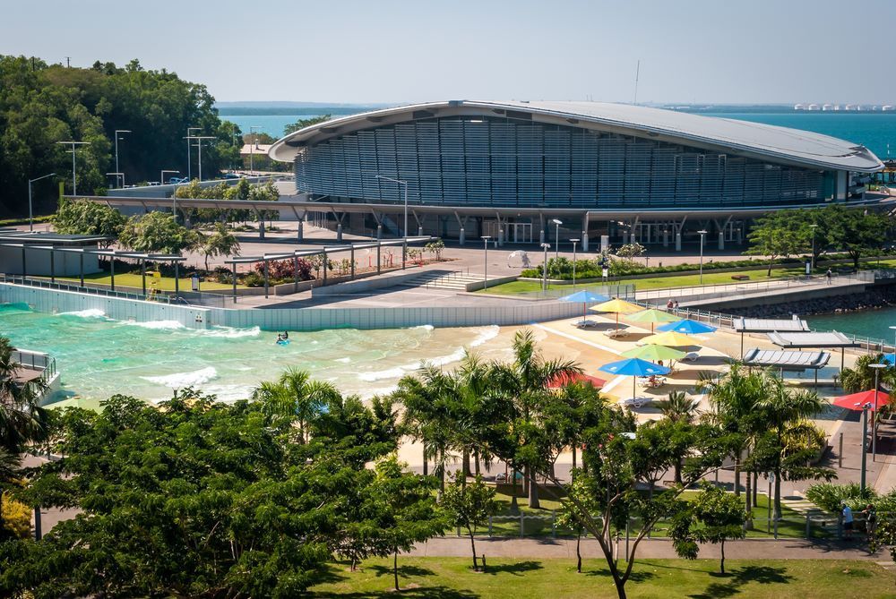 An Aerial View of a Beach With a Large Building in the Background — Go Pack Yourself in Darwin, NT