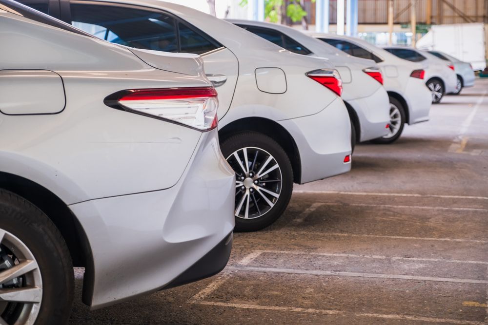 Silver Sedans Parked in a Row, Taillights Visible — Crown Rental Cars in Nightcliff, NT