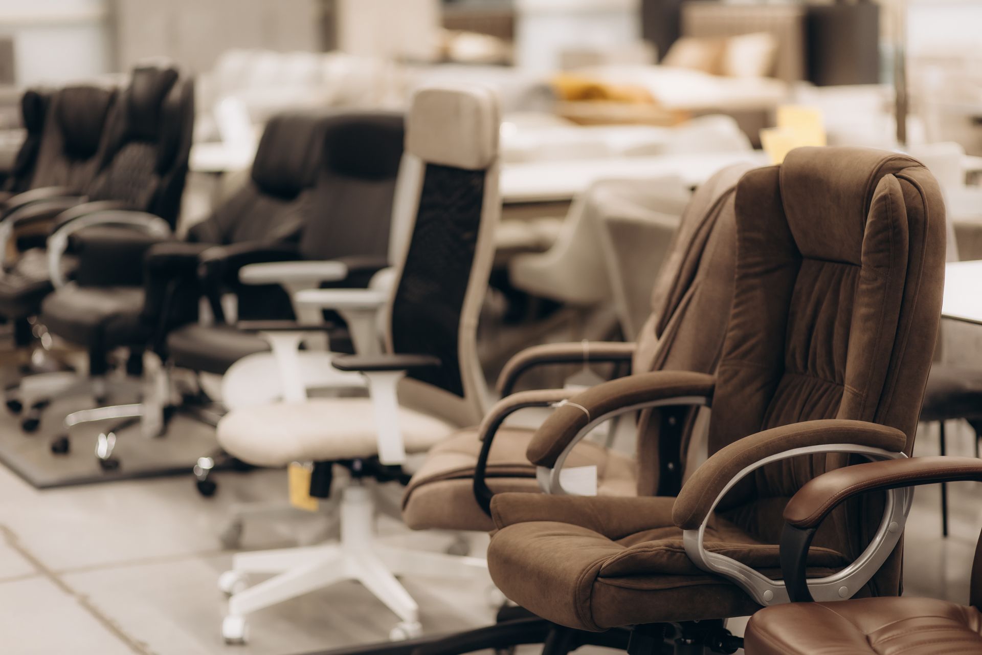 Stylish office chairs displayed in a modern furniture showroom. Stylish office chairs displayed in a modern furniture showroom.