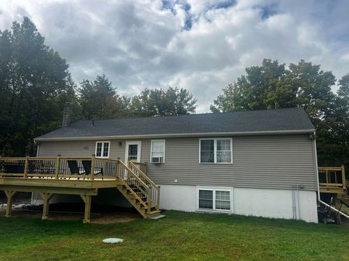 The back of a house with a deck and stairs