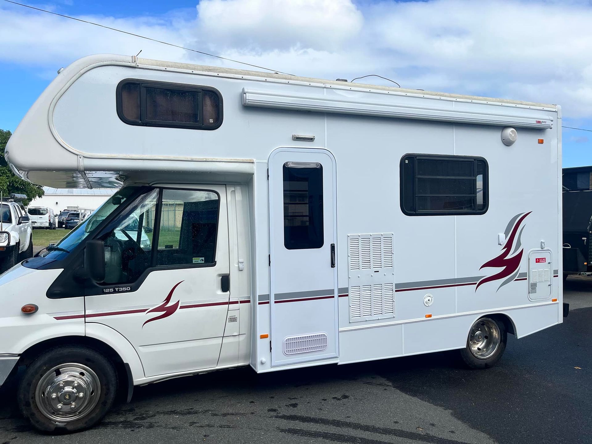 Large, White, Wrapped Machinery Inside A Warehouse — Torque Metro Caravan Services in Archerfield, QLD