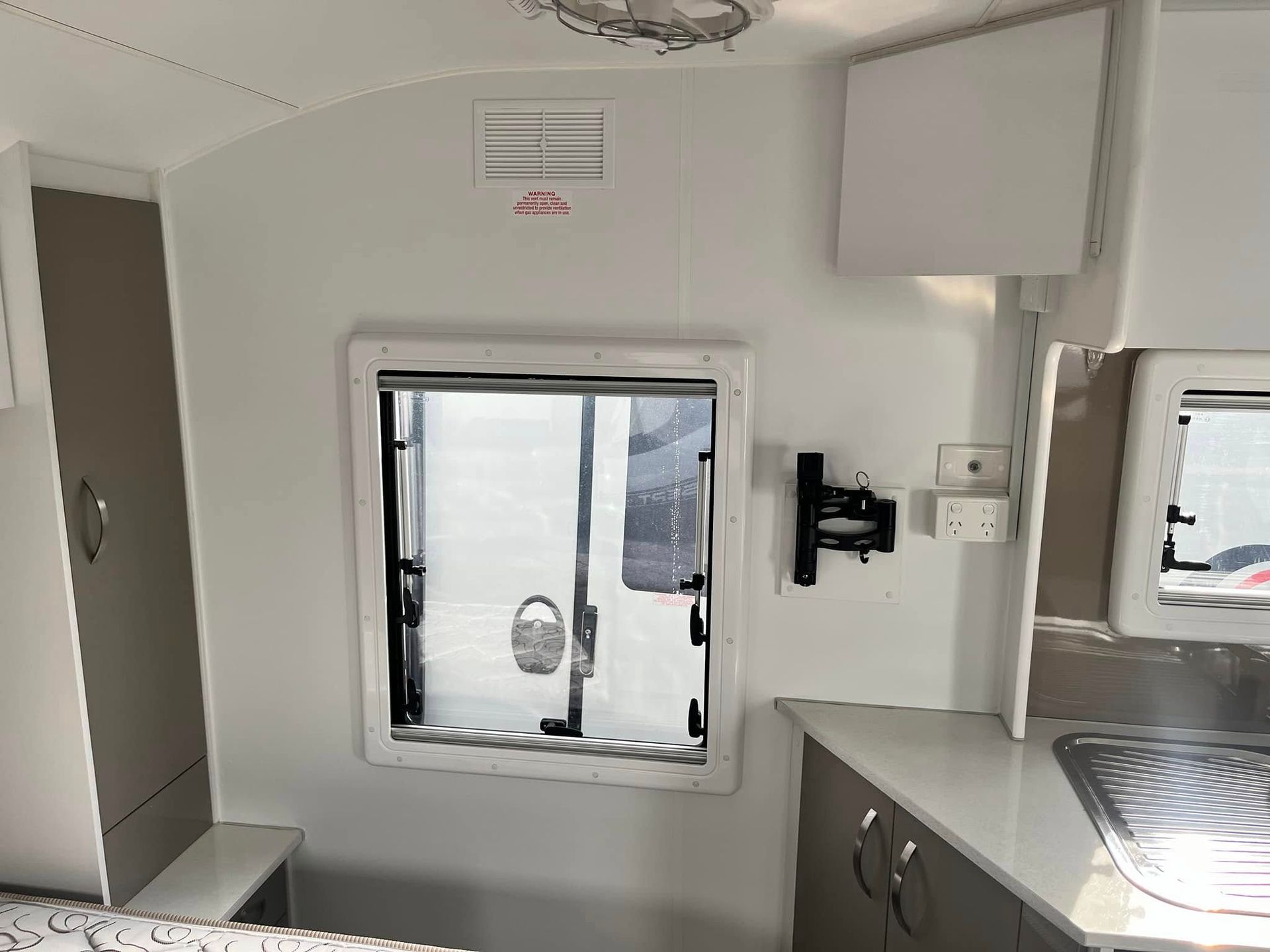 Interior Of A Caravan, White Walls, Open Window — Torque Metro Caravan Services in Archerfield, QLD