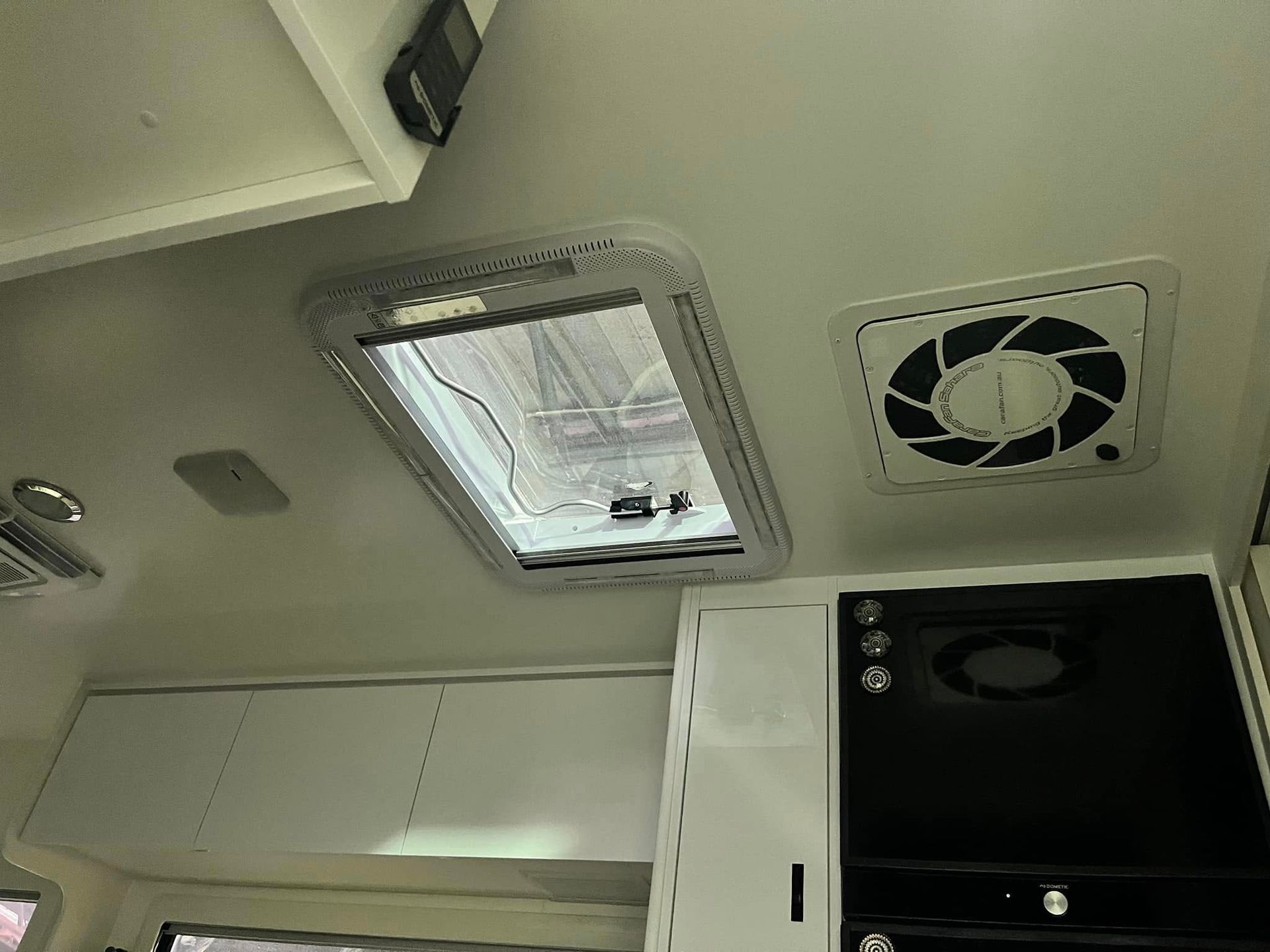 Interior View Of A Caravan Ceiling With A Skylight, Vent, And Cabinets — Torque Metro Caravan Services in Archerfield, QLD