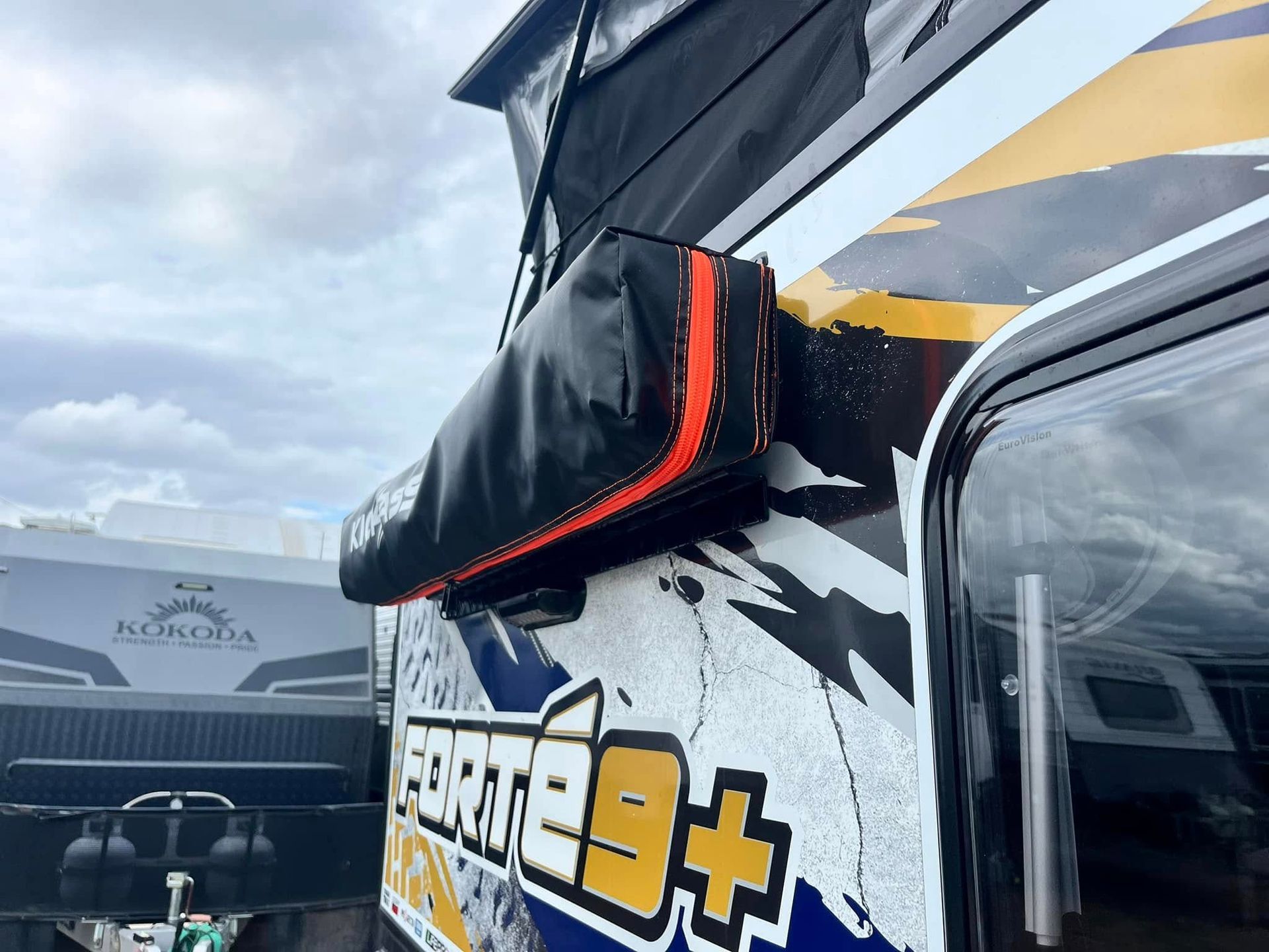 Black Trailer Front With Propane Tank Secured In A Metal Compartment — Torque Metro Caravan Services in Archerfield, QLD