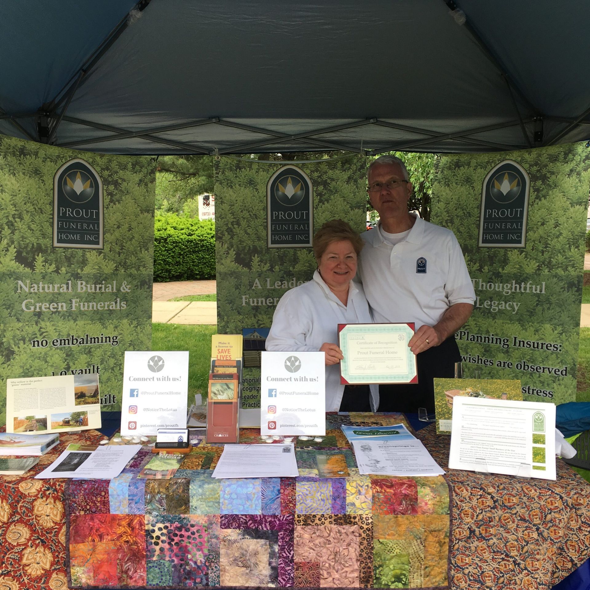 Two people stand behind a 