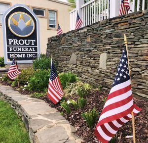 Prout Funeral Home with Memorial Flags in front of the building